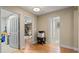 Hallway with wood floors and access to other rooms at 11412 Chateaubriand Ave, Orlando, FL 32836