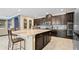 Modern kitchen with dark cabinets and granite island at 11412 Chateaubriand Ave, Orlando, FL 32836