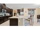 Spacious kitchen with island, stainless steel appliances, and granite countertops at 11412 Chateaubriand Ave, Orlando, FL 32836