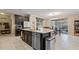 Kitchen with large island, stainless steel appliances, and ample cabinet space at 11412 Chateaubriand Ave, Orlando, FL 32836