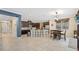 Open concept kitchen with island, breakfast bar, and view to Gathering room at 11412 Chateaubriand Ave, Orlando, FL 32836