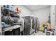 Bright laundry room, featuring washer, dryer, and ample storage shelving at 11412 Chateaubriand Ave, Orlando, FL 32836
