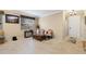 Bright living room with tiled floors and comfy seating at 11412 Chateaubriand Ave, Orlando, FL 32836