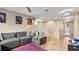 Open living area with sectional sofa and hardwood floor at 11412 Chateaubriand Ave, Orlando, FL 32836