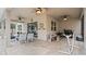 Outdoor patio with seating area, grill, and ceiling fans at 11412 Chateaubriand Ave, Orlando, FL 32836