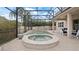 Relaxing pool and spa with covered patio at 11412 Chateaubriand Ave, Orlando, FL 32836
