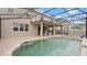 Resort-style pool and spa with patio at 11412 Chateaubriand Ave, Orlando, FL 32836