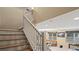 Modern staircase with wooden steps and white railing at 11412 Chateaubriand Ave, Orlando, FL 32836