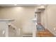 Upstairs hall with wood floors and neutral decor at 11412 Chateaubriand Ave, Orlando, FL 32836