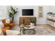 Living room with neutral decor, comfy seating, and large TV at 1273 Coral Bean Ln, Winter Springs, FL 32708