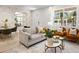 Stylish living room featuring neutral furniture, modern decor, and bright natural light at 1273 Coral Bean Ln, Winter Springs, FL 32708
