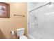Bright bathroom with a clear glass shower door, essential fixtures, and a towel rack at 1375 Tuscana Ln # 1107, Davenport, FL 33896