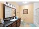Bathroom features a granite countertop, vanity, and a shower and bathtub combo at 1375 Tuscana Ln # 1107, Davenport, FL 33896