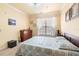 Bright bedroom with natural light, carpet floors, and a queen sized bed at 1375 Tuscana Ln # 1107, Davenport, FL 33896