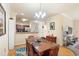 Dining area with wood table, chairs, adjacent to kitchen, and featuring stylish decor at 1375 Tuscana Ln # 1107, Davenport, FL 33896