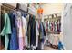 Spacious walk-in closet with hanging racks and shelving for optimal organization at 1375 Tuscana Ln # 1107, Davenport, FL 33896