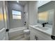 Modern bathroom with white tiled shower and vanity at 150 Marion Oakes Trl, Ocala, FL 34473