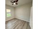 Bright bedroom features a ceiling fan, window with blind, and light-colored walls at 150 Marion Oakes Trl, Ocala, FL 34473