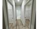 Bright hallway connecting to two walk-in closets at 150 Marion Oakes Trl, Ocala, FL 34473