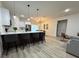 Open-concept kitchen with island seating flows into the living area at 150 Marion Oakes Trl, Ocala, FL 34473