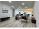 Open floor plan features a living room with modern decor flowing into the kitchen and dining areas at 150 Marion Oakes Trl, Ocala, FL 34473