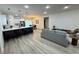 Spacious open-concept with stainless steel appliances and white countertop island at 150 Marion Oakes Trl, Ocala, FL 34473