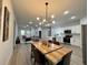 Inviting living space with open floor plan connecting dining, kitchen and living areas at 150 Marion Oakes Trl, Ocala, FL 34473