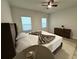 Bright main bedroom with natural light coming from two windows at 150 Marion Oakes Trl, Ocala, FL 34473