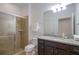 Bathroom with walk-in shower, granite vanity, and toilet at 1505 Mumbai Way, Kissimmee, FL 34747