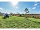 Large backyard with green grass and a jet ski on trailer at 157 Pineywoods St, St Cloud, FL 34769