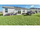 Backyard with solar panels, jet ski, and bikes at 157 Pineywoods St, St Cloud, FL 34769