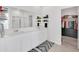 Elegant bathroom with double vanity, walk-in shower, and large closet at 157 Pineywoods St, St Cloud, FL 34769