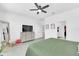 Main bedroom with king-size bed, dresser and large mirror at 157 Pineywoods St, St Cloud, FL 34769