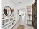 Bright entryway with a stylish console table and large mirror at 157 Pineywoods St, St Cloud, FL 34769