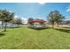 Community gazebo with picnic tables in grassy area at 157 Pineywoods St, St Cloud, FL 34769