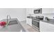 Modern kitchen with stainless steel appliances and a large island at 157 Pineywoods St, St Cloud, FL 34769