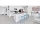 Island kitchen with light blue stools and modern finishes at 157 Pineywoods St, St Cloud, FL 34769