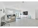 Spacious living room features a large sectional sofa and tile floors at 157 Pineywoods St, St Cloud, FL 34769
