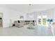 Spacious living room with large sectional sofa and plenty of natural light at 157 Pineywoods St, St Cloud, FL 34769
