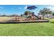playground with play structures and shaded area at 157 Pineywoods St, St Cloud, FL 34769