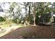 Large backyard with trampoline, shed, and mature trees at 176 E Grandbend Ave, Lake Mary, FL 32746