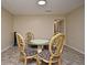 Dining area with glass-top table and four ornate chairs at 176 E Grandbend Ave, Lake Mary, FL 32746
