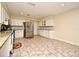Modern kitchen with white cabinets, granite counters, and stainless steel appliances at 176 E Grandbend Ave, Lake Mary, FL 32746
