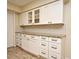 White kitchen cabinets, granite countertops, and ample storage space at 176 E Grandbend Ave, Lake Mary, FL 32746