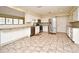 Modern kitchen with white cabinets, granite counters, and stainless steel appliances at 176 E Grandbend Ave, Lake Mary, FL 32746