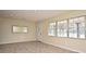 Bright living room with tile floors and large windows at 176 E Grandbend Ave, Lake Mary, FL 32746