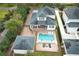 A beautiful aerial view of the home, including the pool, outdoor patio, and detached garage at 179 Hillcrest Dr, Oviedo, FL 32765