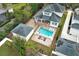 Stunning aerial view of a home with a pristine backyard pool and a detached garage at 179 Hillcrest Dr, Oviedo, FL 32765