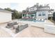 An amazing backyard with a beautiful pool, outdoor seating, and landscaped patio area at 179 Hillcrest Dr, Oviedo, FL 32765