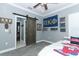 Bedroom with ceiling fan, barn door and carpeted floors at 179 Hillcrest Dr, Oviedo, FL 32765